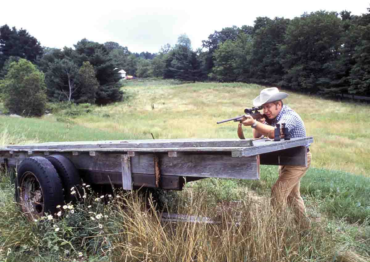 Another prop is something that always seems to be around a New England farm, that of an abandoned hay wagon. Note that Stan is shooting away from the farmhouse in the background with his Weatherby Vanguard rifle.
